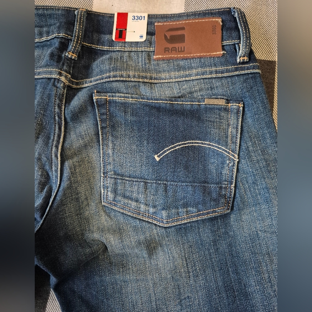 Womans size 28 Gstar 3301 straight medium aged blue denim
